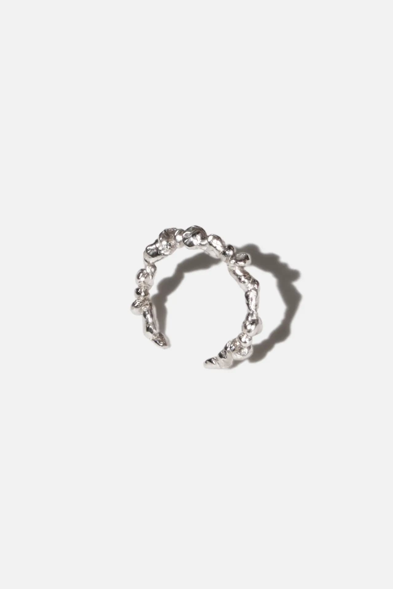 An angled image of FEMANCE Silver Stacked Stone Ring